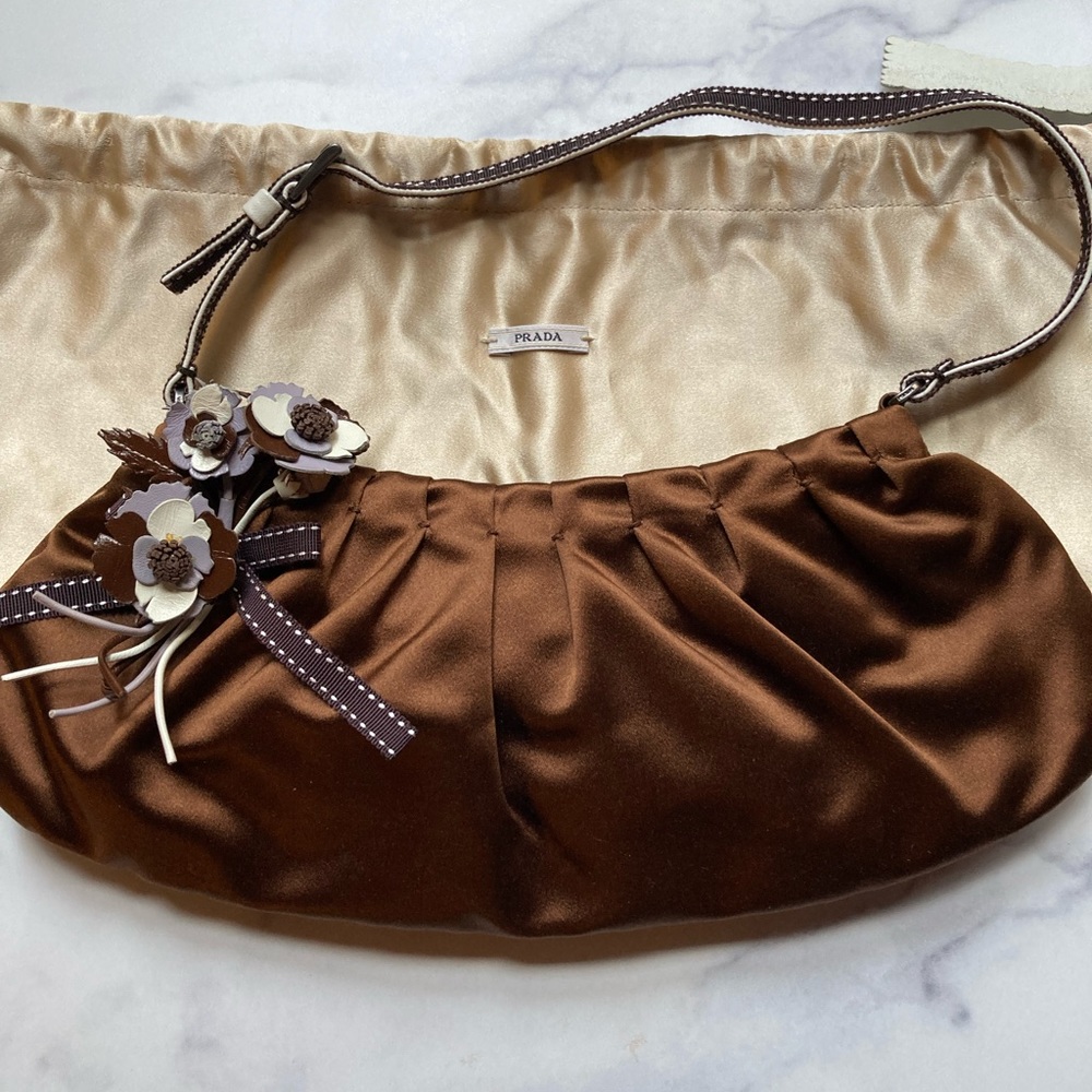 Prada- Raso plisse’ane, with auth cards, very cute goes well with any outfit
